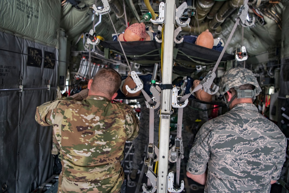 Loading a C-130 during Patient Movement exercises at Northern Strike 19