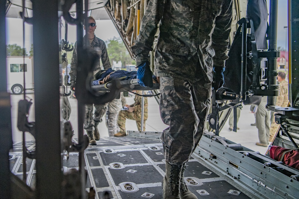 Aeromedical Evacuation exercises while loading a C-130 at Northern Strike 19