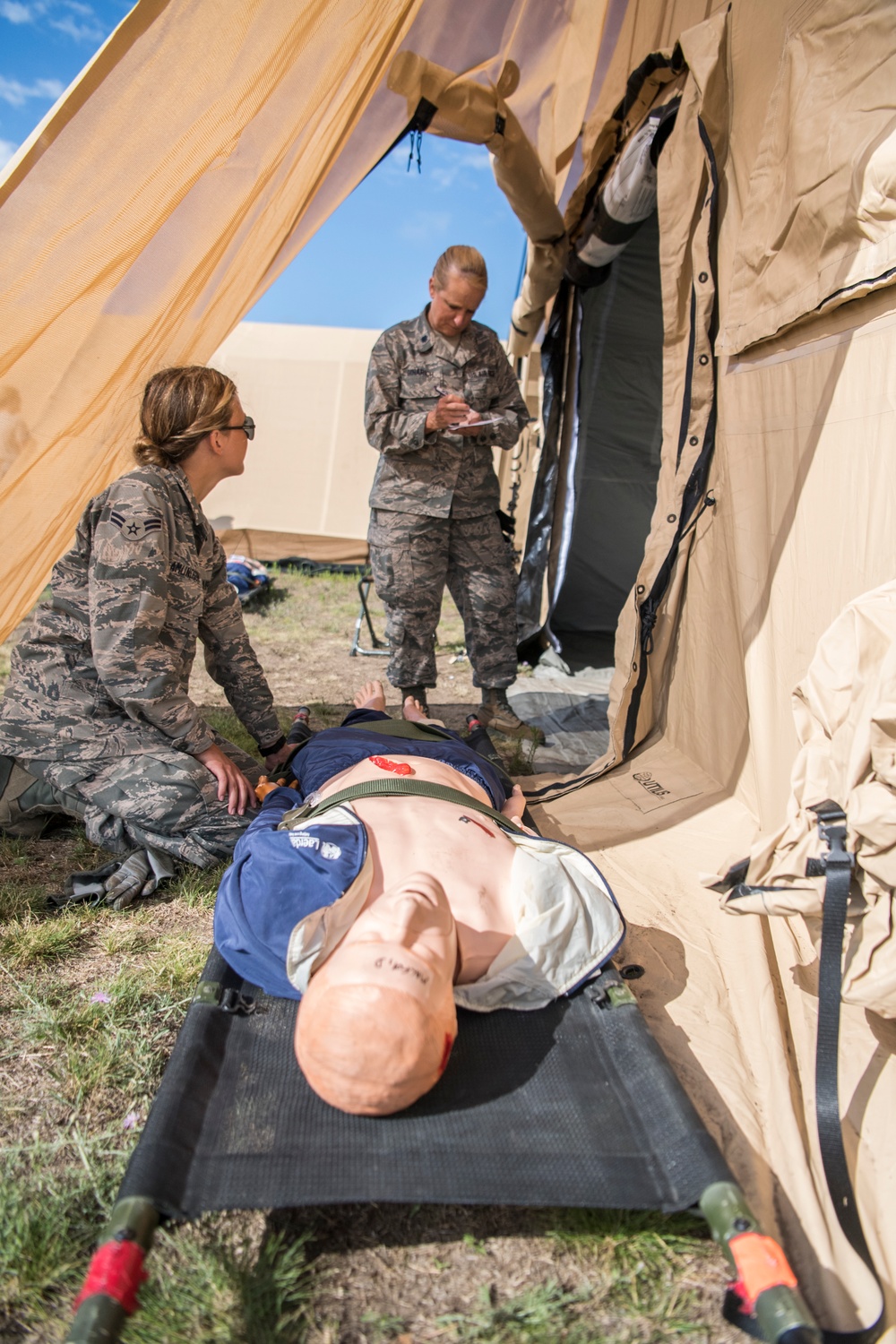 Assessing a patient during Aeromedical Exercise at Northern Strike 19