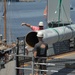 Battleship Wisconsin staff crane aboard empty missile tubes