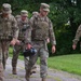 Chief Master Sgt. Katie McCool participates in a 3.5-mile ruck march with SF Airmen