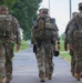 Chief Master Sgt. Katie McCool joins Whiteman AFB SF Airmen in a training ruck march