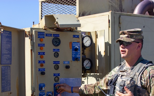 Soldier operates pump station during QLLEX-E