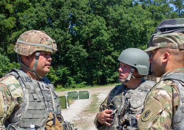 Soldiers discuss operations during QLLEX-E