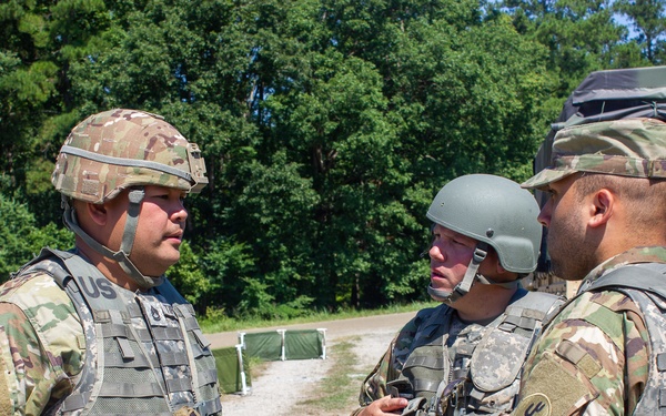 Soldiers discuss operations during QLLEX-E