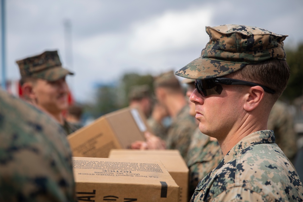 U.S. Marines disembark the USNS Fall River