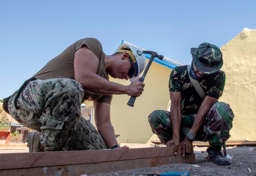 NMCB-4, Indonesian National Armed Forces continue construction at SDN Duduk Sampeyan Elementary School during CARAT 2019