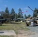 German and American Soldiers stand next to their vehicles enjoying the festivities.