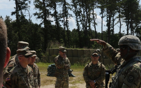 Distinguished civilian and military leaders visit the training sites for combined arms exercise Patriot Crucible at Camp Edwards August 3.
