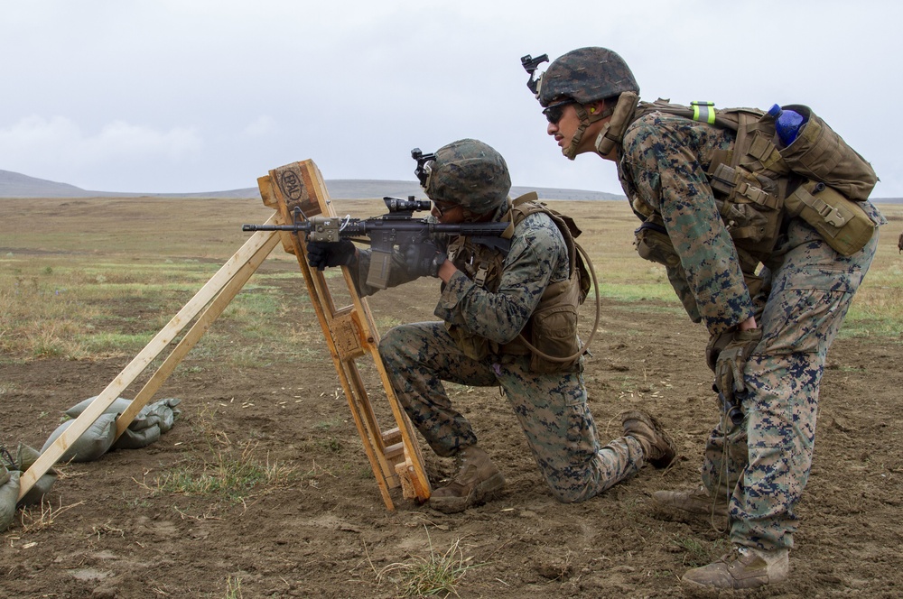 U.S. Marines and British soldiers conduct stress shoot