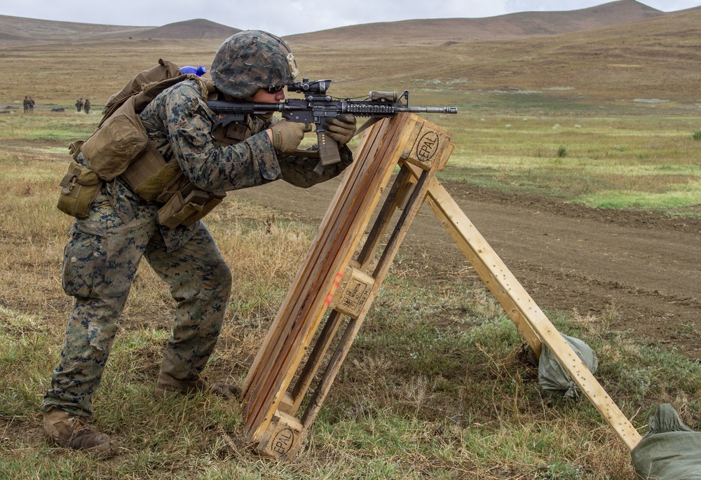 U.S. Marines and British soldiers conduct stress shoot