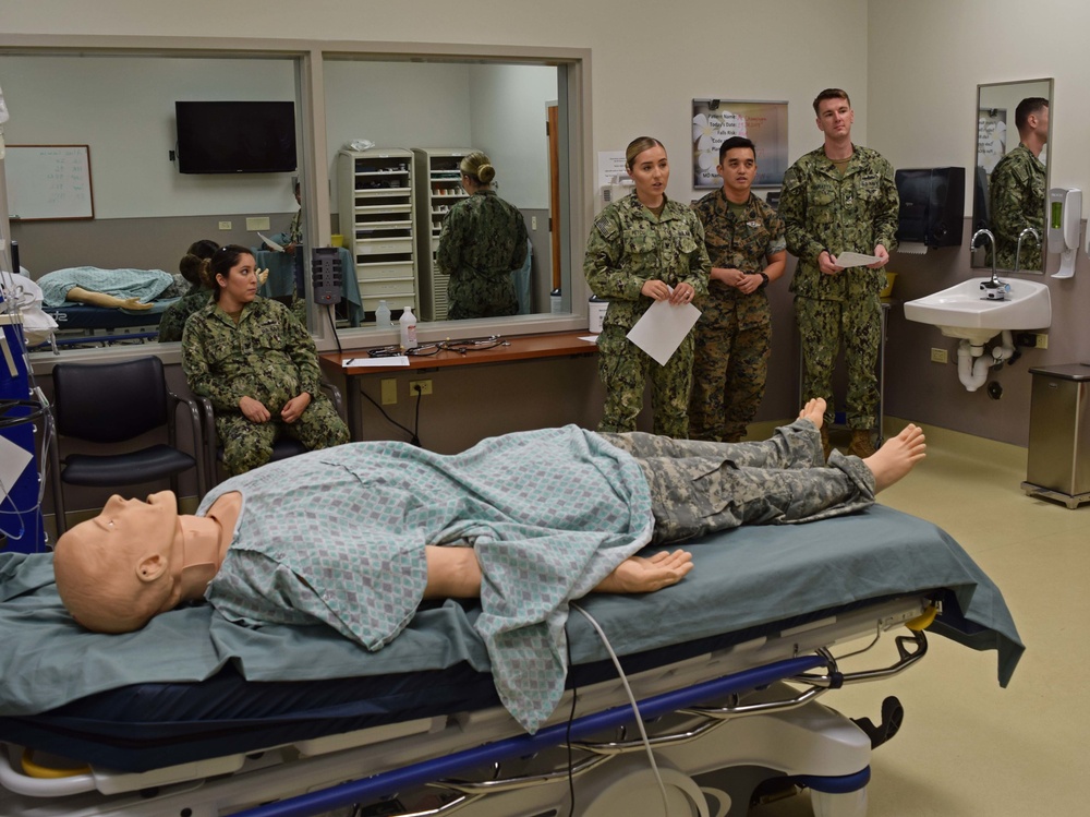 Students engage in a simulator training at Tripler Army Medical Center