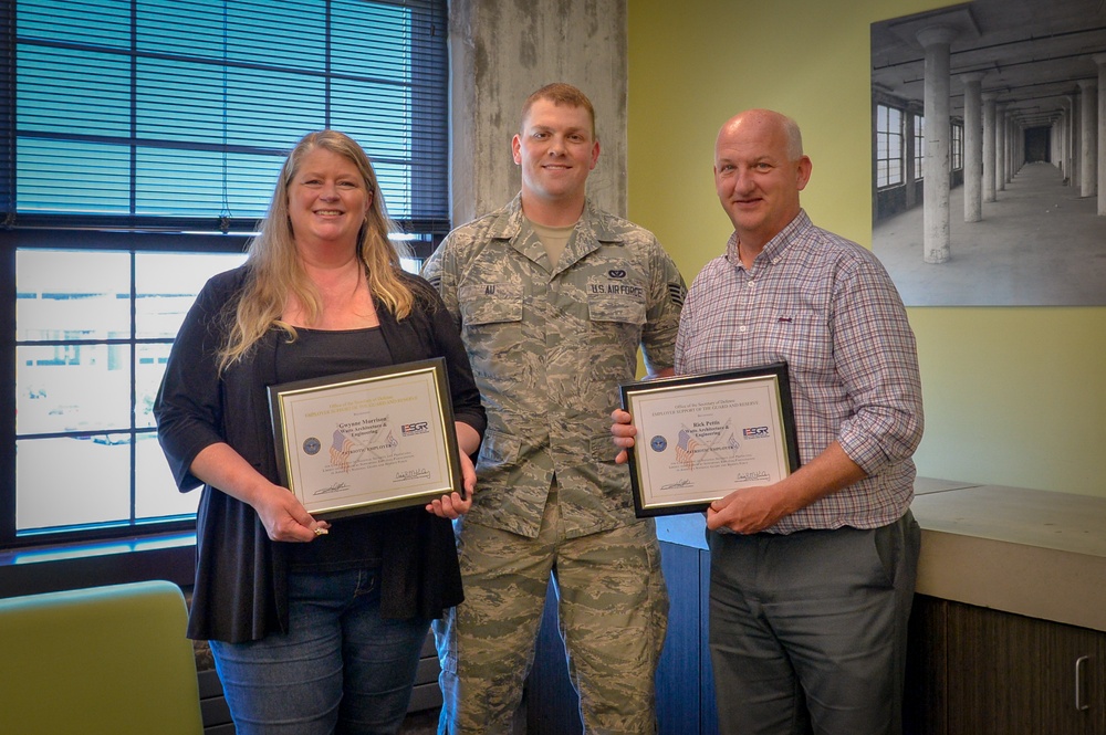 Airman Presents Patriot Award to Employers