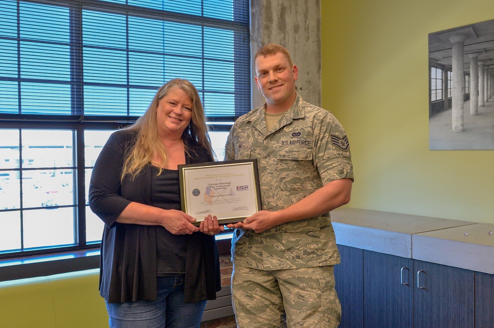 Airman Presents Patriot Award to Employeers