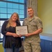 Airman Presents Patriot Award to Employeers