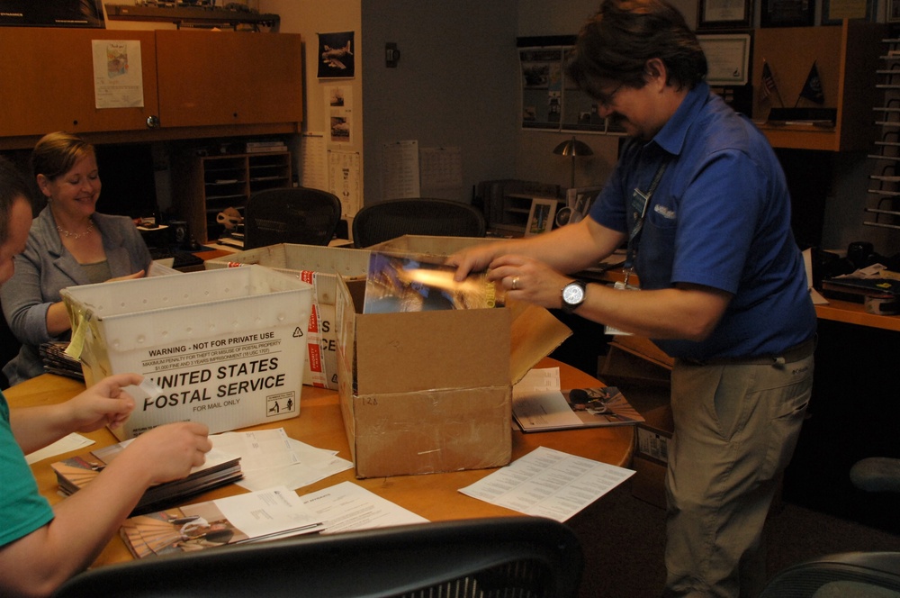 Preparing museum's quarterly historical publication for mailing