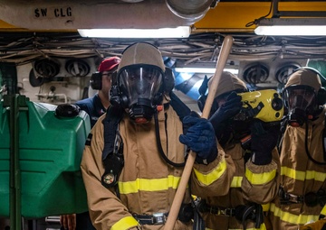 Sailors conduct a DC Drill in MMR 1