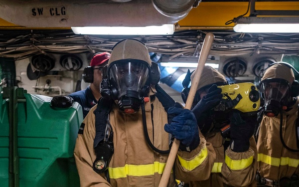 Sailors conduct a DC Drill in MMR 1