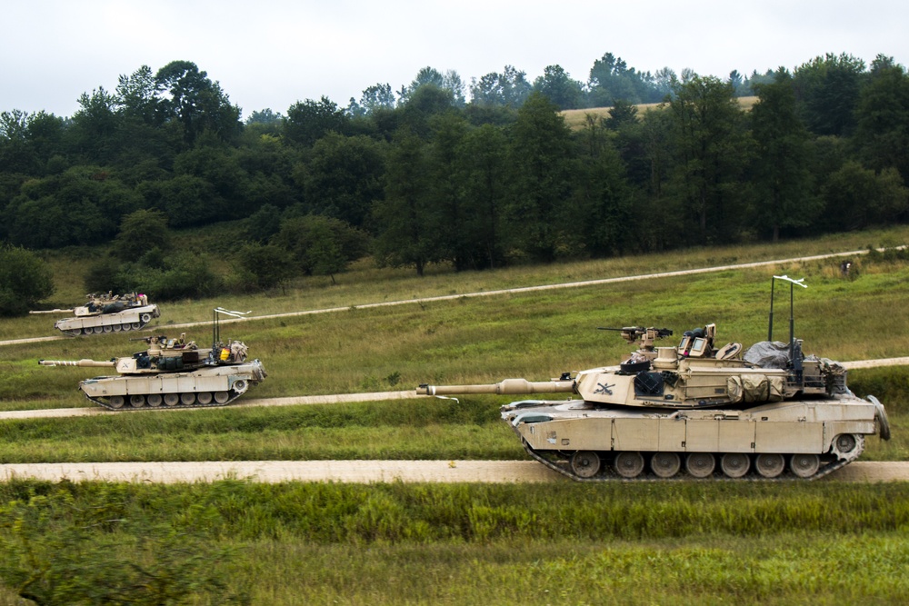 M1A2 Abram tank Troops drive down the road during a Combined Resolve live fire training exercise in Grafenwoehr Training Area, August, 8, 2019.
