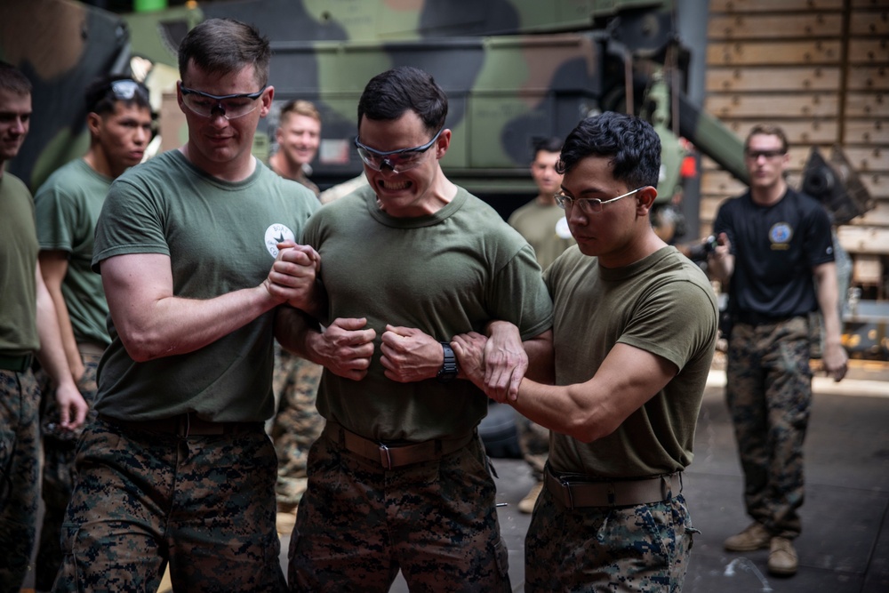 31st MEU Marines hold taser qualification training aboard USS Ashland