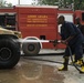 Ethiopian firefighters spray muddy Humvee