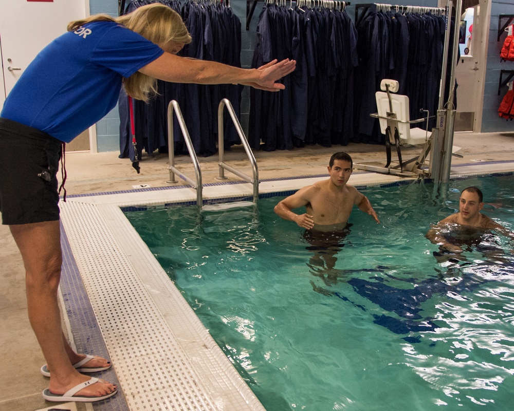 Officer Candidate School (OCS) class 15-19 here at the Lt. Michael P. Murphy Combat Training Pool in Newport, Rhode Island qualifies during the second class swimmer test on Aug. 9, 2019.