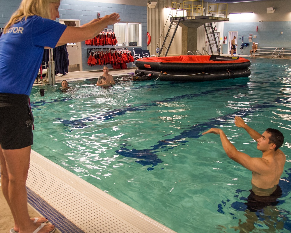 Officer Candidate School (OCS) class 15-19 here at the Lt. Michael P. Murphy Combat Training Pool in Newport, Rhode Island qualifies during the second class swimmer test on Aug. 9, 2019.