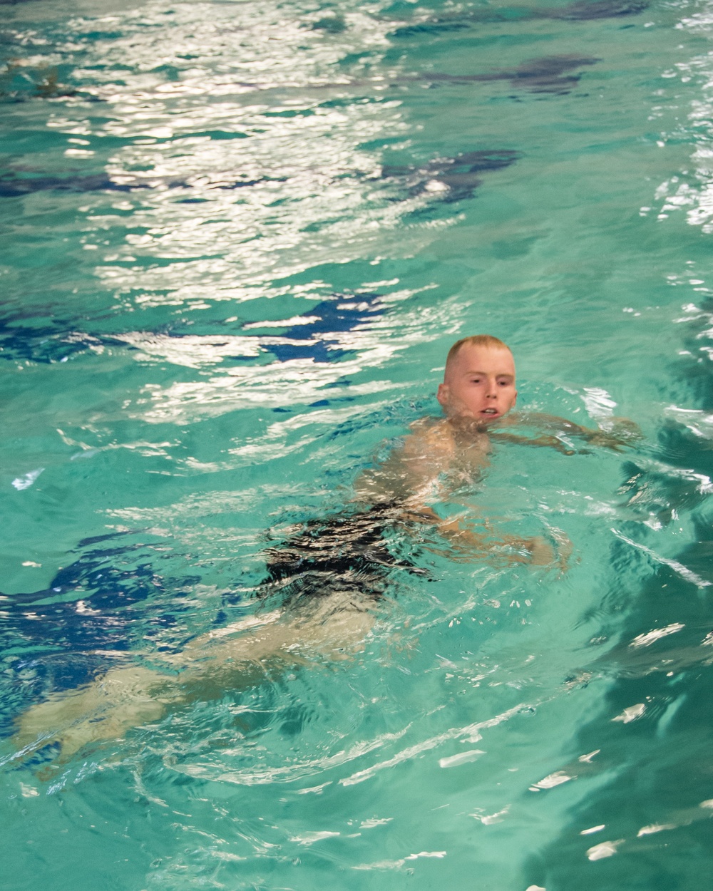 Officer Candidate School (OCS) class 15-19 here at the Lt. Michael P. Murphy Combat Training Pool in Newport, Rhode Island qualifies during the second class swimmer test on Aug. 9, 2019.