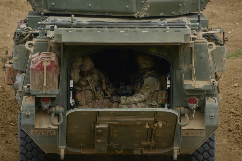 A Soldier closes the hatch of a 30 mm Stryker Infantry Carrier Vehicle - Dragoon