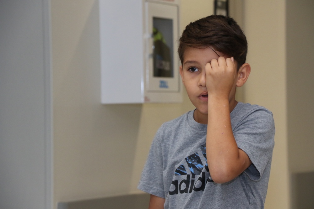 Child takes vision test at Baumholder Clinic back-to-school event