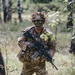 Soldier moves through woods