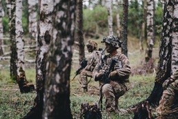 Soldiers wait for signal to move