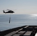 MH-60S Sea Hawk conducts an ammo offload