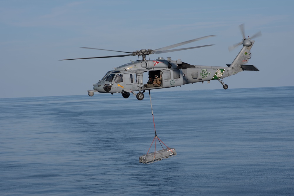 MH-60S Sea Hawk conducts an ammo offload