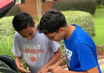 Student volunteers achieve a mission for community beyond summer months