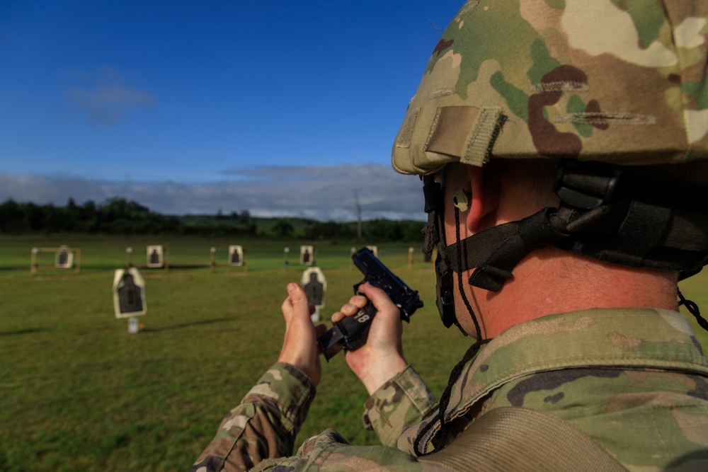 Sgt. Michael Yarrington reloads M9