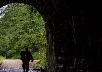 A U.S. Army Reserve Reserve soldier enters a tunnel