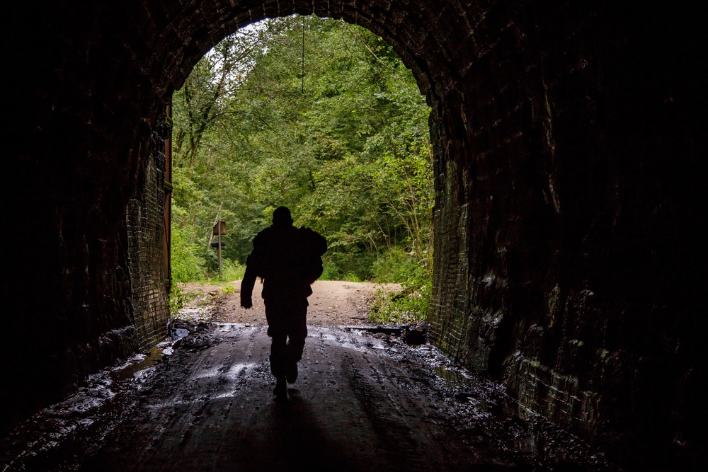 A U.S. Army Reserve Reserve soldier enters a tunnel