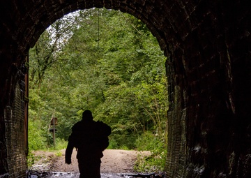 A U.S. Army Reserve Reserve soldier enters a tunnel