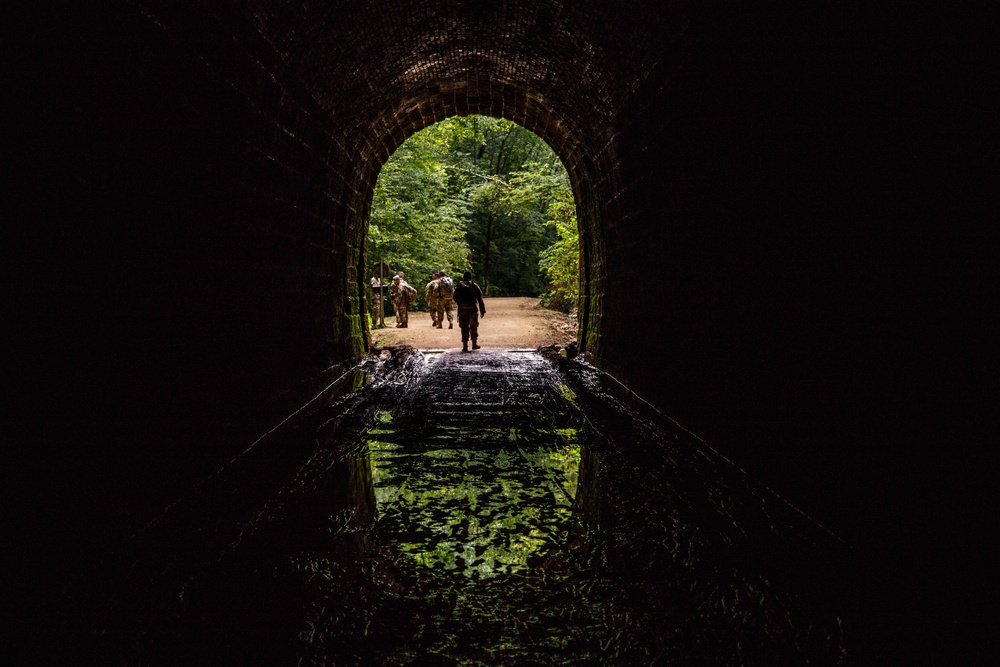 Cadre supporting the U.S. Army Reserve Best Warriors and Drill Sergeants of the Year exit a tunnel