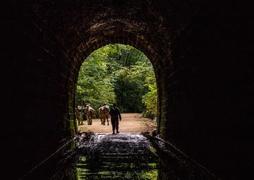 Cadre supporting the U.S. Army Reserve Best Warriors and Drill Sergeants of the Year exit a tunnel