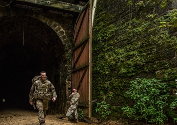 Sgt. Joshua Smith emerges from a tunnel
