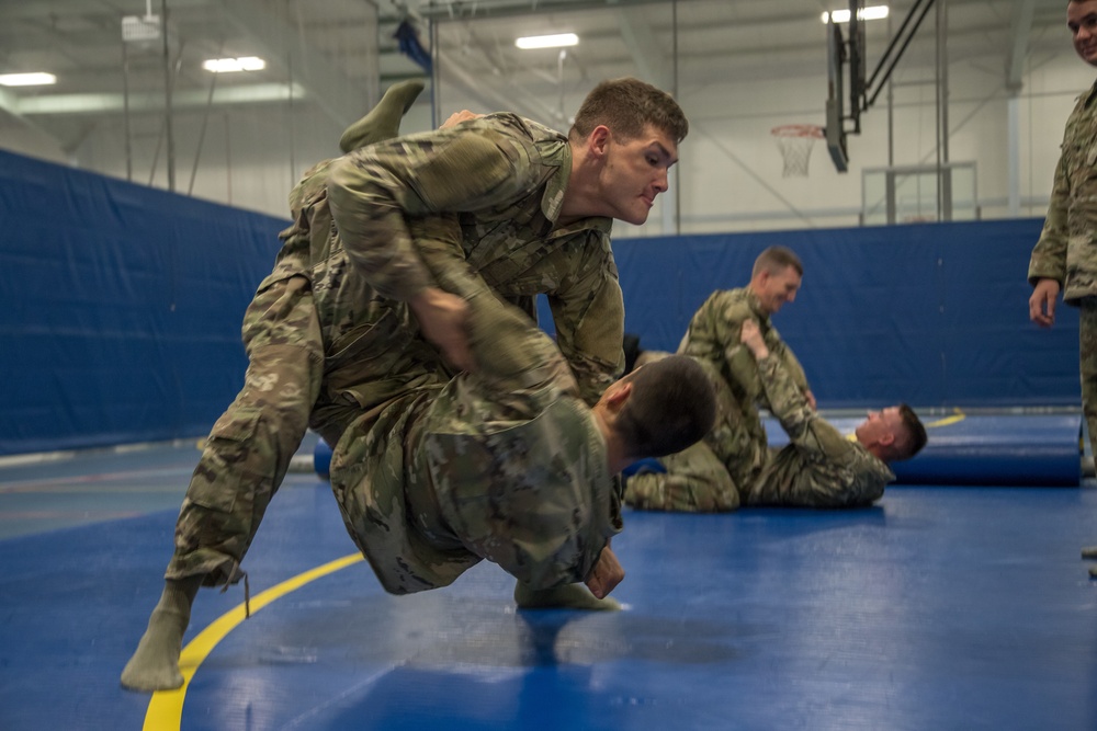 Spc. Collin George practices Modern Army Combatives with Spc. Kalon Williams