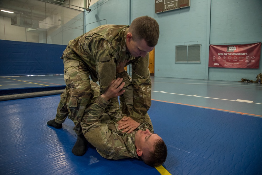 Sgt. Joshua Smith practices Modern Army Combatives with Sgt. Michael Yarrington