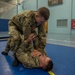 Sgt. Joshua Smith practices Modern Army Combatives with Sgt. Michael Yarrington