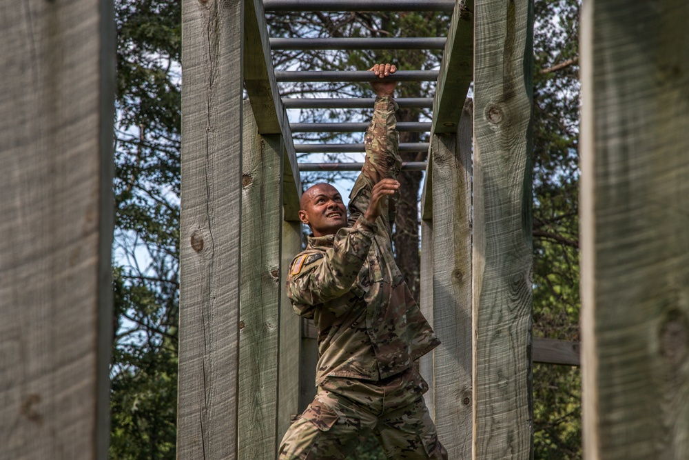 Sgt. Edward Singh swings to the next rung