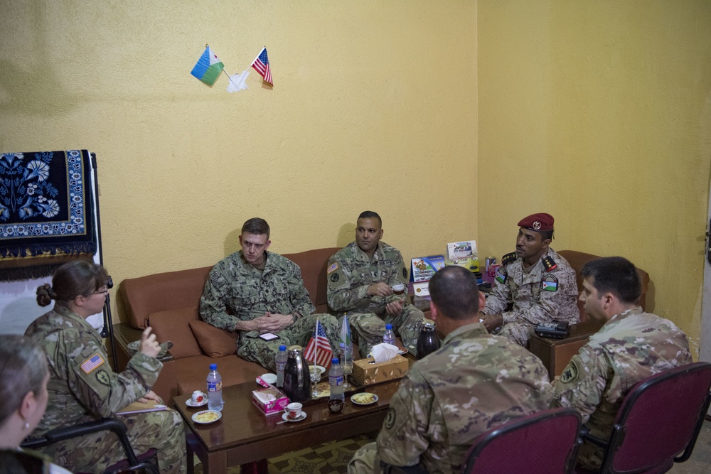 U.S. military personnel speak with Djiboutian