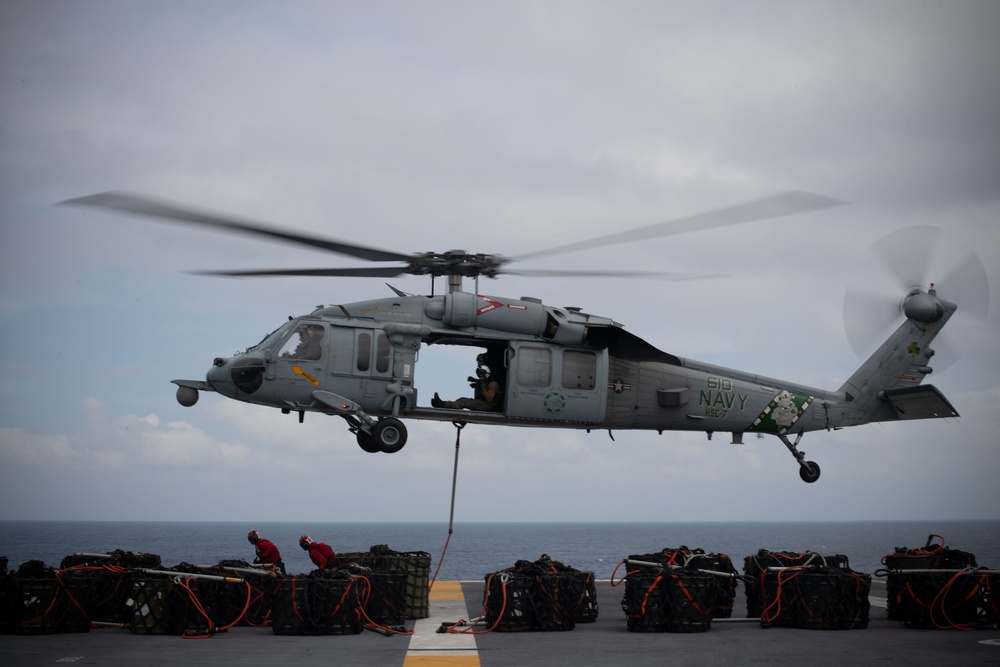 An MH-60S Sea Hawk, assigned to Helicopter Sea Combat Squadron (HSC) 7, transports ammunition