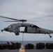 An MH-60S Sea Hawk, assigned to Helicopter Sea Combat Squadron (HSC) 7, transports ammunition
