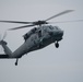 An MH-60S Sea Hawk, assigned to Helicopter Sea Combat Squadron (HSC) 2, approaches the aircraft carrier USS John C. Stennis (CVN 74)